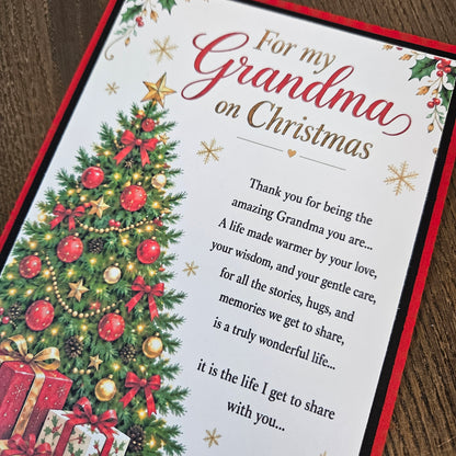 Angled close-up of a 5 x 7 Grandma Christmas card with red border, decorated tree and printed poem.