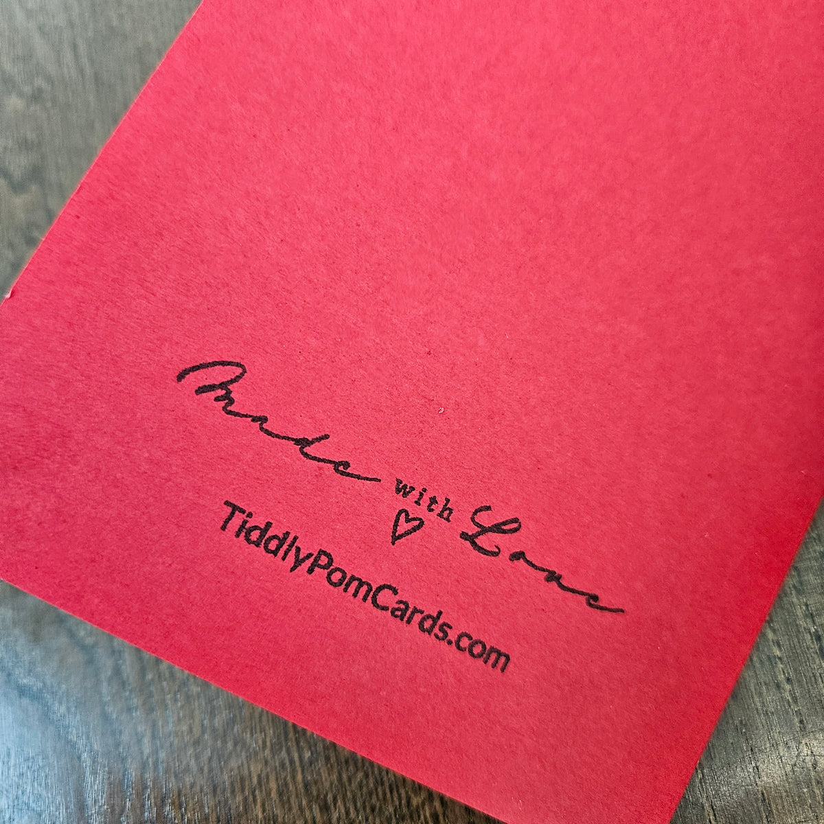 Red back of the handmade gothic birthday card stamped Made with Love and TiddlyPomCards.com.