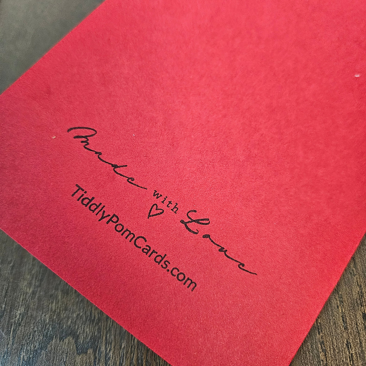 Red back of the handmade snowman Christmas card stamped Made with Love and TiddlyPomCards.com.