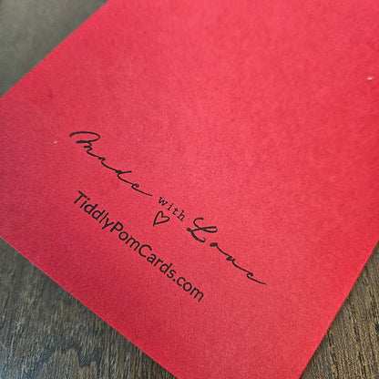 Red back of the handmade snowman Christmas card stamped Made with Love and TiddlyPomCards.com.