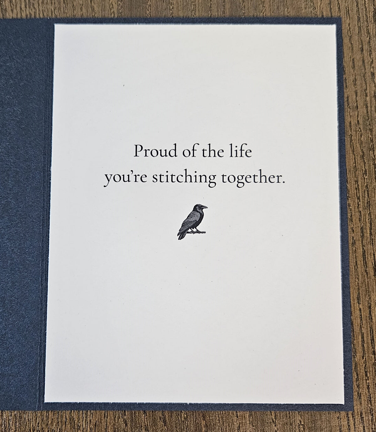 Printed inside message Proud of the life you’re stitching together with a small raven illustration