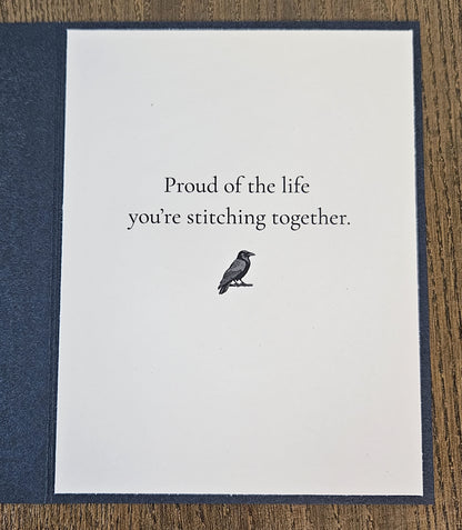 Printed inside message Proud of the life you’re stitching together with a small raven illustration