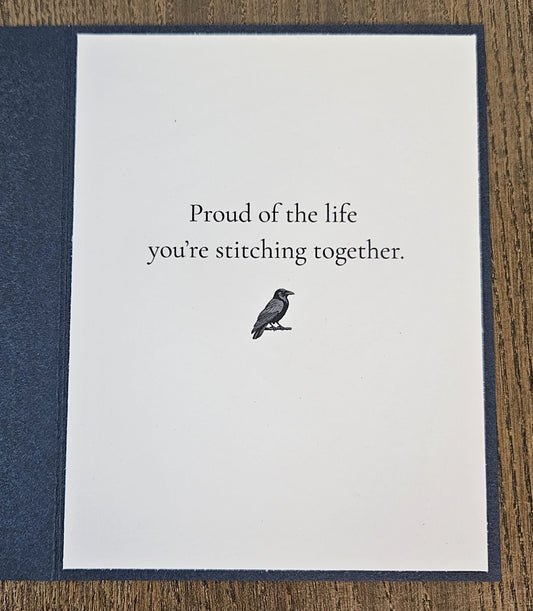 Printed inside message Proud of the life you’re stitching together with a small raven illustration