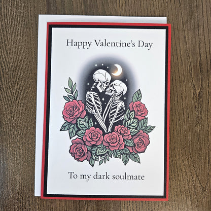 Full gothic dark soulmate Valentine card with its coordinating envelope on a wooden surface.