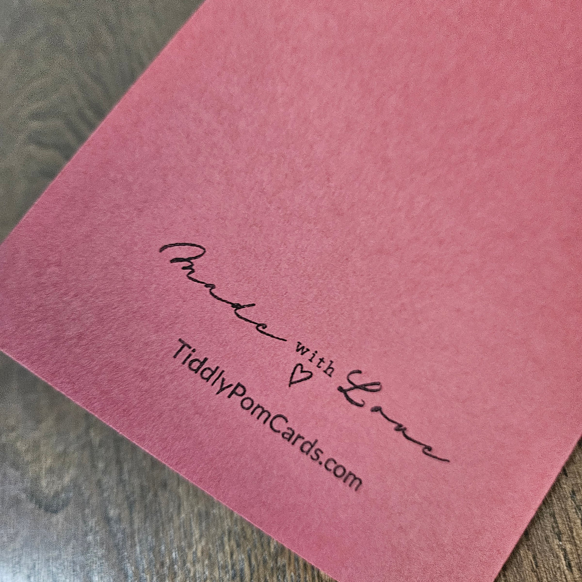 Muted red back of the handmade dog Christmas card stamped Made with Love and TiddlyPomCards.com.