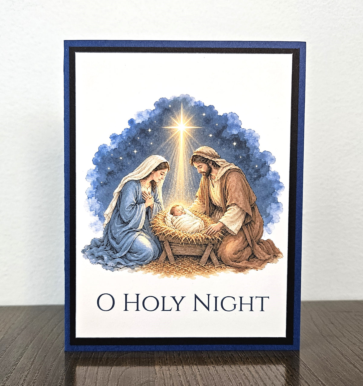 Handmade O Holy Night nativity Christmas card with Mary, Joseph and baby Jesus beneath a bright star