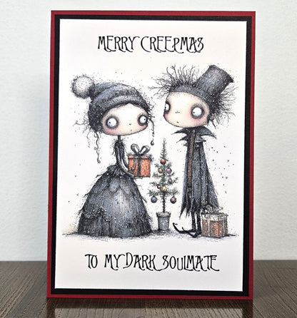 Handmade Merry Creepmas card for a dark soulmate with a gothic couple exchanging gifts beside a Christmas tree