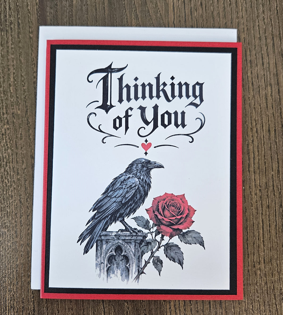 Red back of the handmade raven greeting card stamped Made with Love and TiddlyPomCards.com.