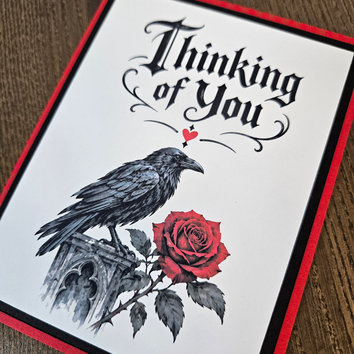 Open red greeting card showing a blank white inside panel for a personal handwritten message.