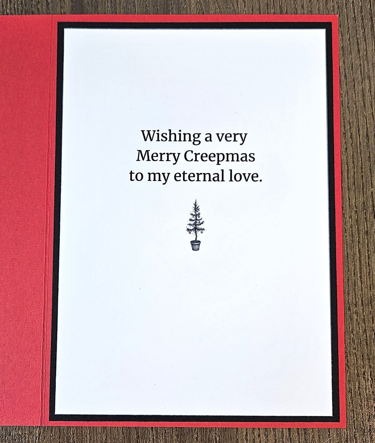 Red back of the handmade card stamped Made with Love and TiddlyPomCards.com.