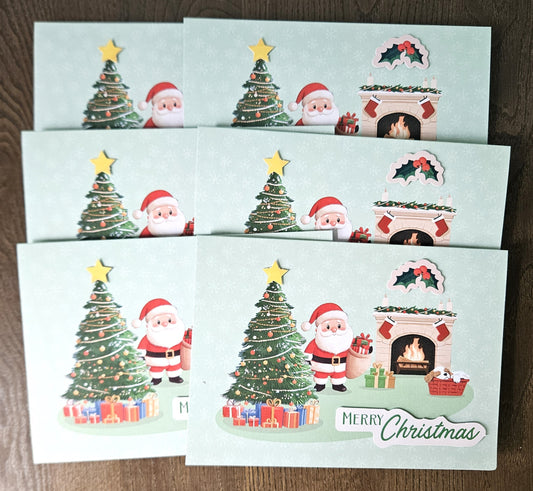 Six Christmas greeting cards arranged in a grid on a dark wood surface. Each card features festive illustrations including Santa Claus, a decorated Christmas tree, gifts, a fireplace, and the words 'Merry Christmas'.