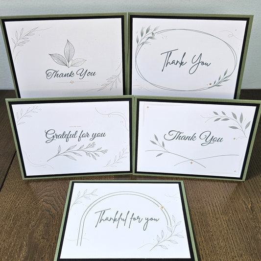 Five assorted A2 botanical thank-you cards displayed upright and flat, showing all five leafy designs.