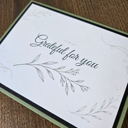 Grateful for you card with a fine leafy branch illustration and black cardstock layer on sage green.