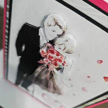 Illustration of a couple embracing with flowers, surrounded by pink petals on a white background.